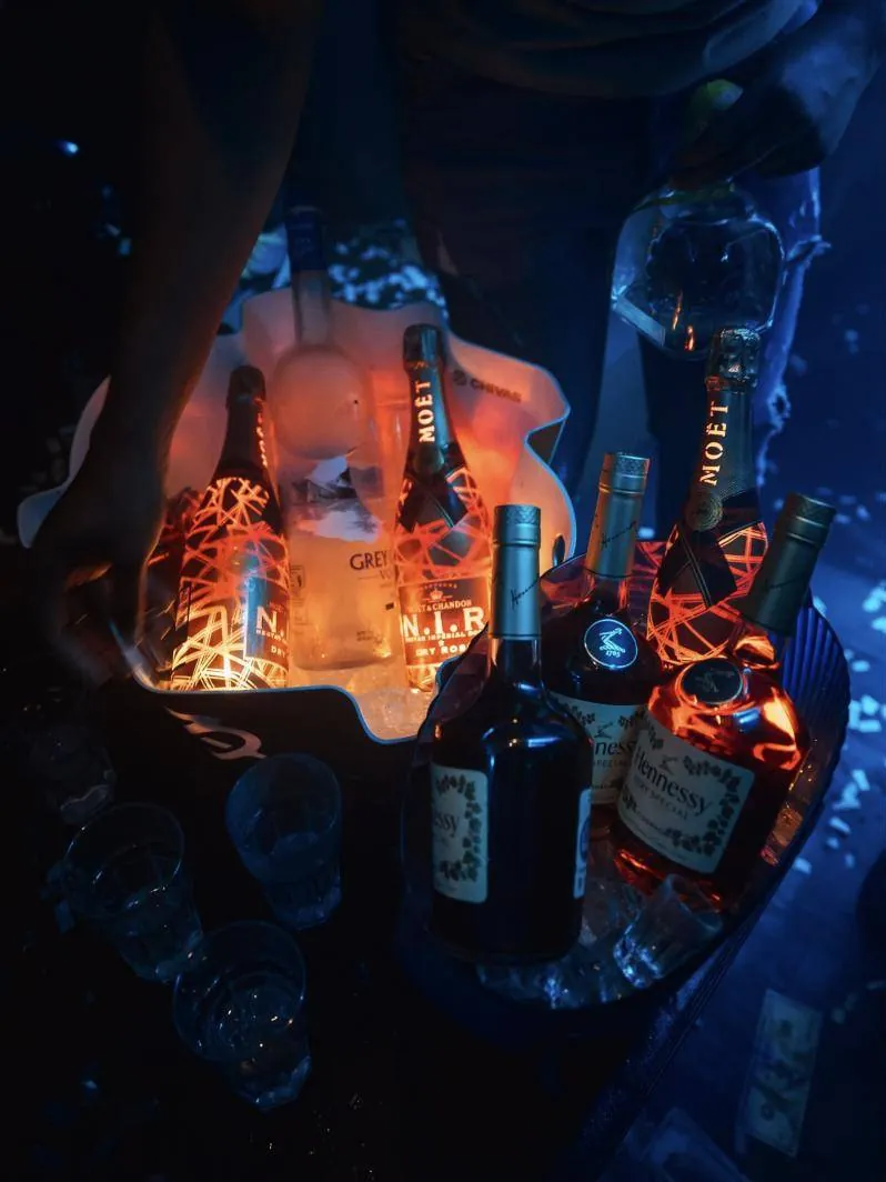 Bottles lit from below on a table