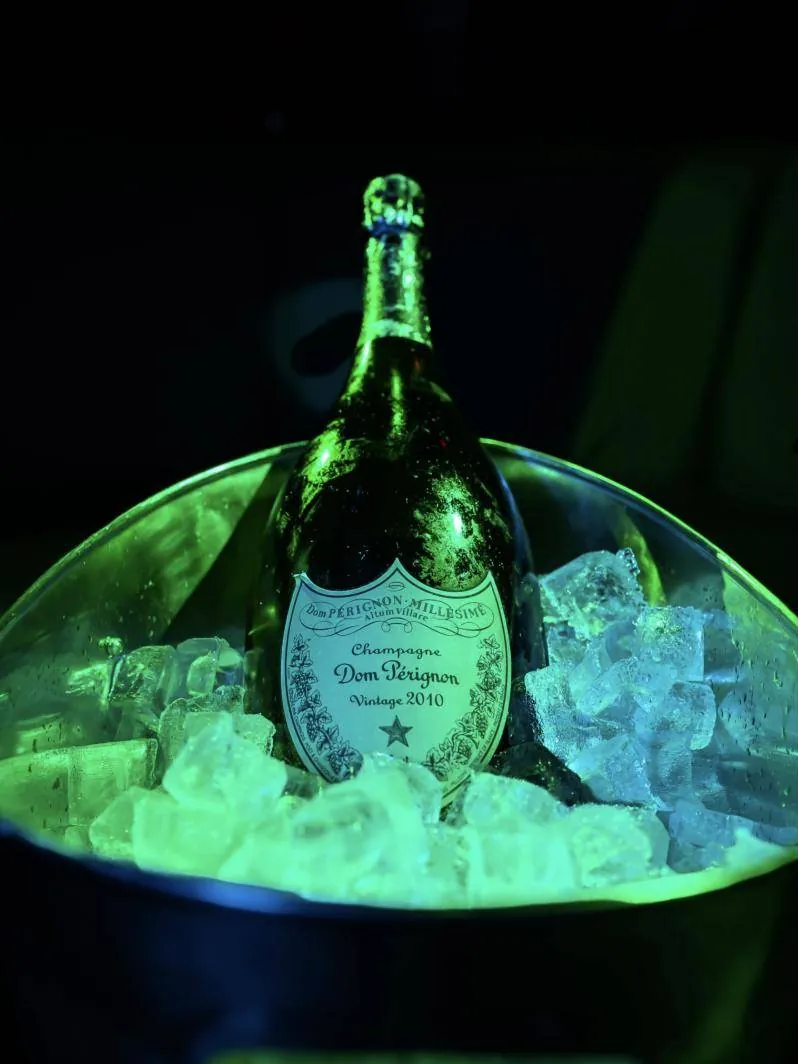 Dom Pérignon on ice, lit green
